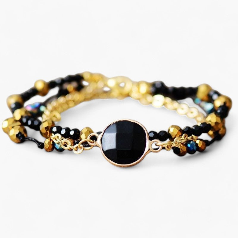 Armband "Positive Aura" mit vergoldeten Perlen aus schwarzem Onyx