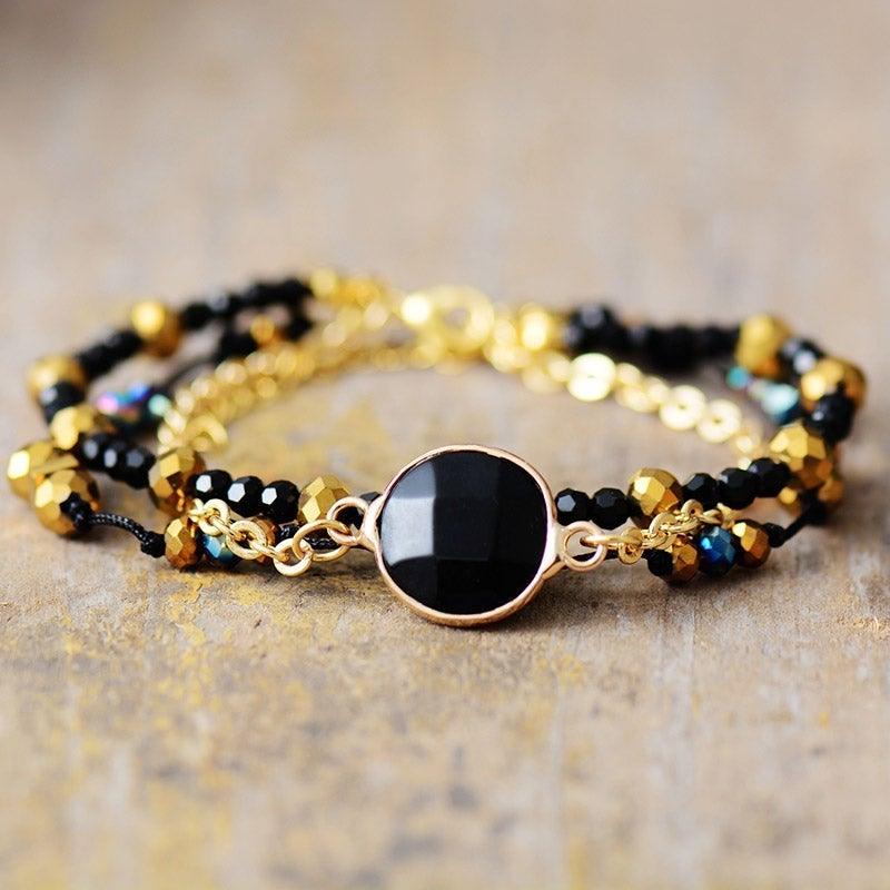 Armband "Positive Aura" mit vergoldeten Perlen aus schwarzem Onyx