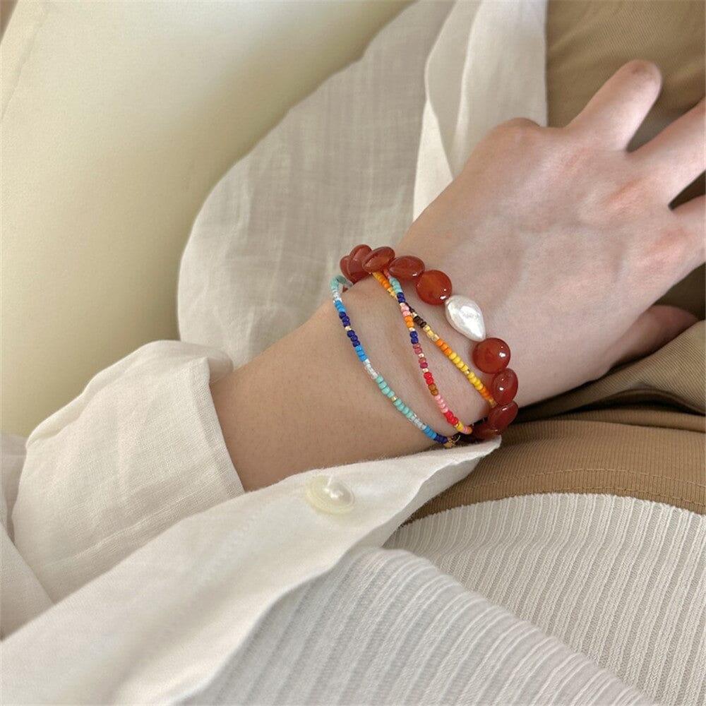 Armband "Strahlende Balance" aus rotem Achat und Perle