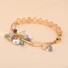 Armband "Goldsegen" mit gelbem Kristall, Amethyst, weißem Türkis und Aquamarin