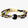 Armband "Positive Aura" mit vergoldeten Perlen aus schwarzem Onyx